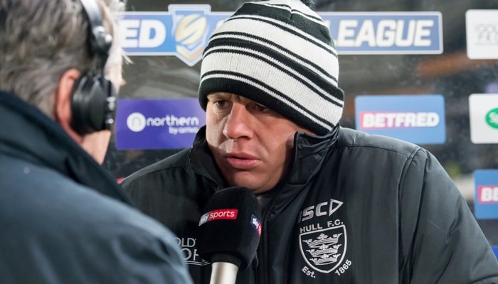 Lee Radford as Hull FC head coach, is interviewed. He looks cold, and wears a beanie in FC colours - black and white.