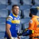 Leeds Rhinos star David Fusitu'a and a water carrier.