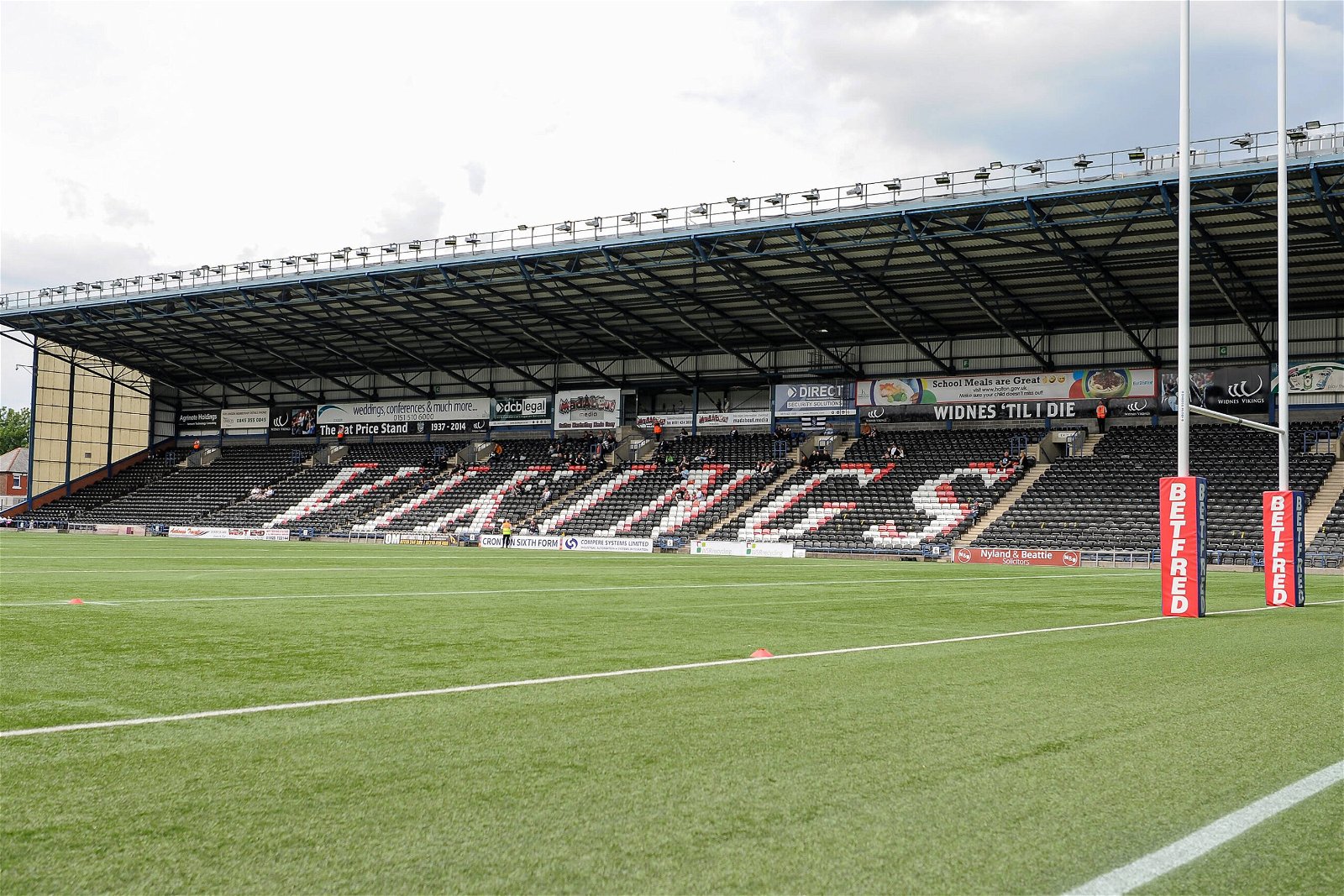 General view of an empty Halton Stadium - black seats, with VIKINGS in white lettering.