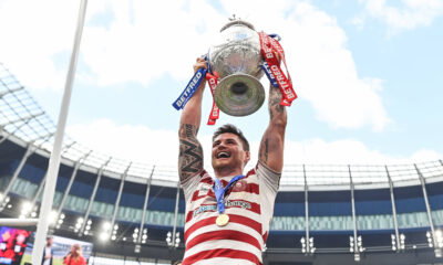 John Bateman lifts the Challenge Cup trophy for Wigan Warriors at the Tottenham Hotspur Stadium.