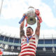 John Bateman lifts the Challenge Cup trophy for Wigan Warriors at the Tottenham Hotspur Stadium.