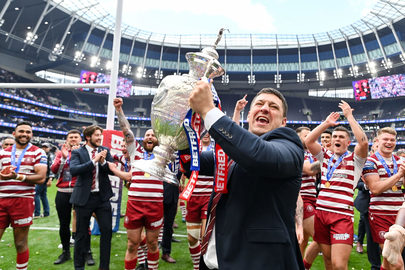 Matt Peet of Wigan Warriors lifts the Challenge Cup trophy