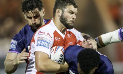 Hull KR's Matty Storton is tackled by Wigan's Toby King