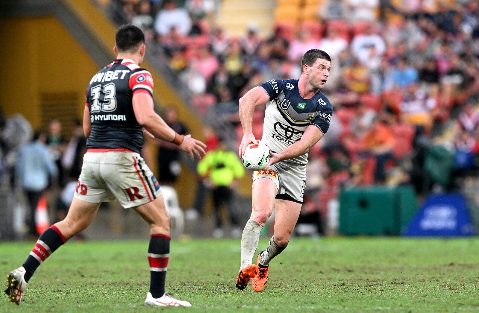 Chad Townsend passes the ball while playing against Sydney Roosters in the NRL.