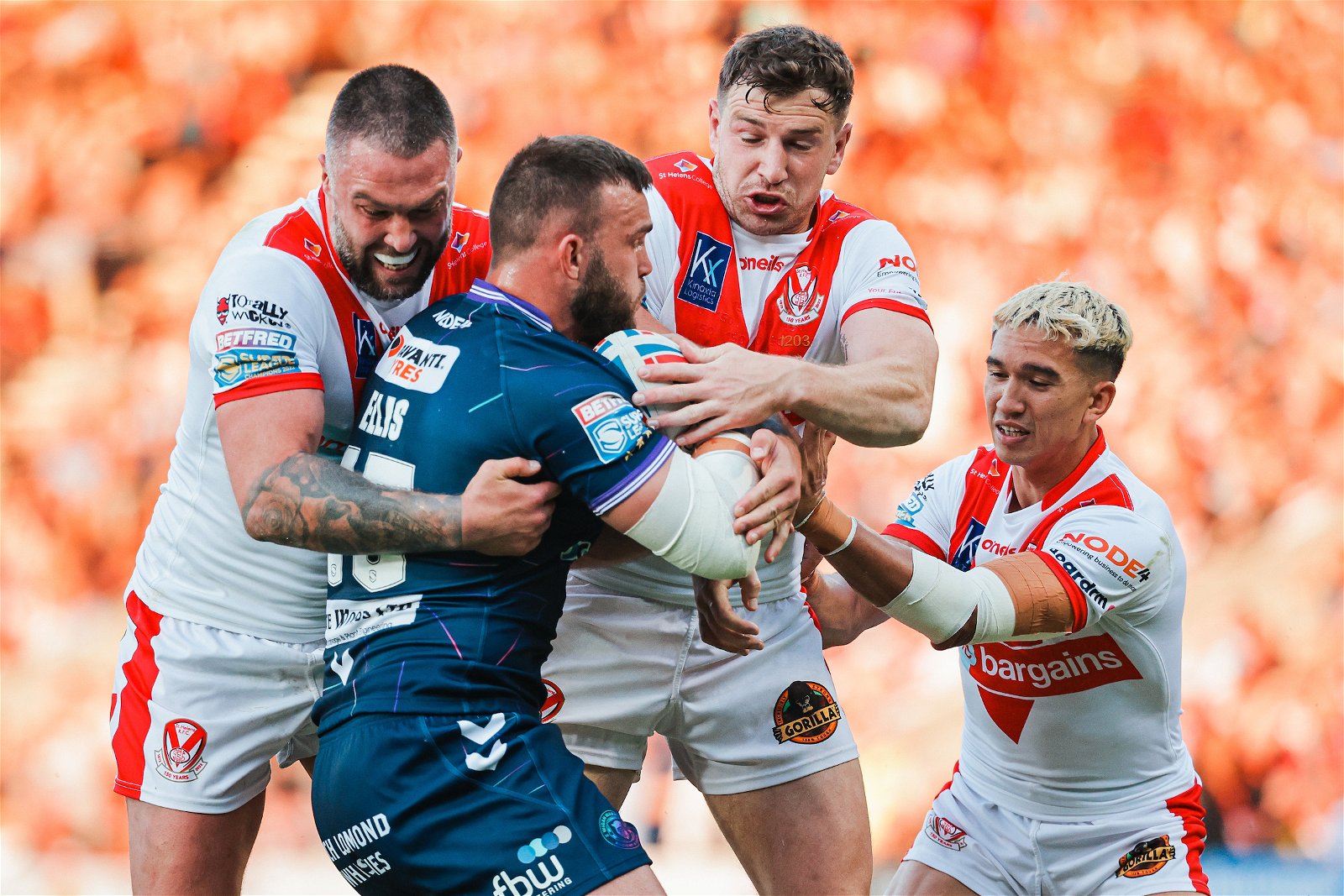 Wigan’s Kaide Ellis is tackled by St Helens’ Curtis Sironen, Mark Percival and Tee Ritson.