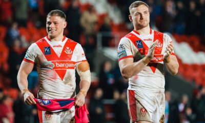 Matty Lees and Morgan Knowles clap in St Helens shirts.
