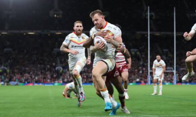 Tom Johnstone is tackled during the Betfred Super League Grand Final match between Wigan Warriors and Catalan Dragons at Old Trafford