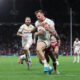 Tom Johnstone is tackled during the Betfred Super League Grand Final match between Wigan Warriors and Catalan Dragons at Old Trafford