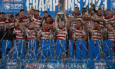 Wigan Warriors lift the Grand Final trophy