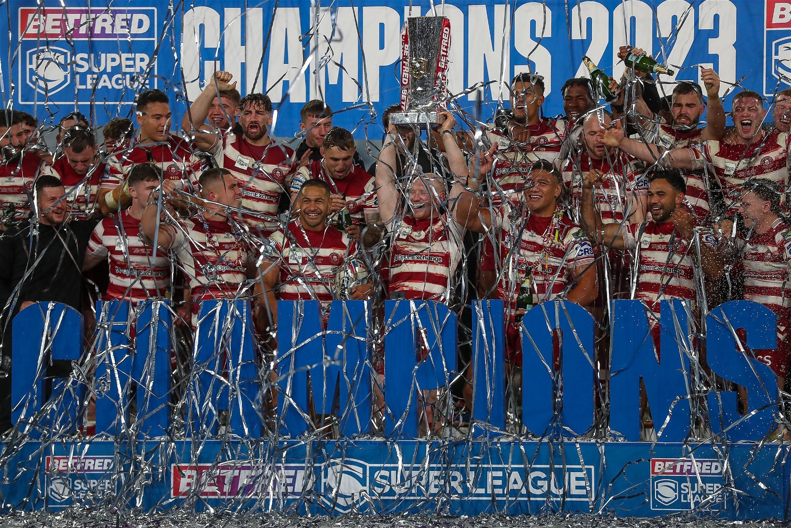 Wigan Warriors lift the Grand Final trophy