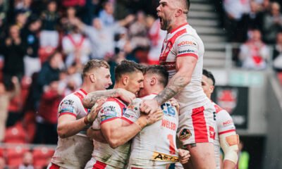 St Helens player Tommy Makinson celebrates after scoring a try.