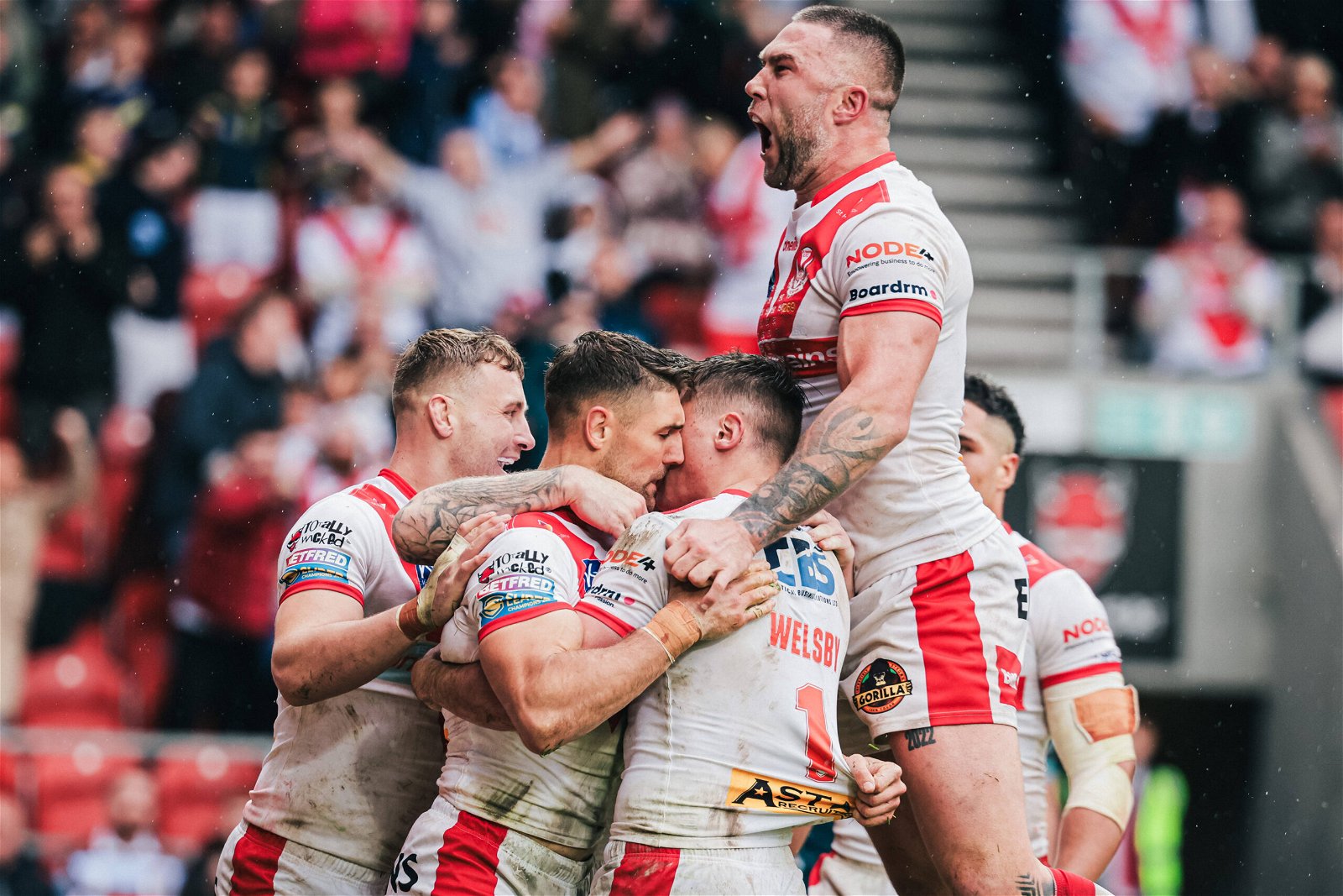 St Helens player Tommy Makinson celebrates after scoring a try.