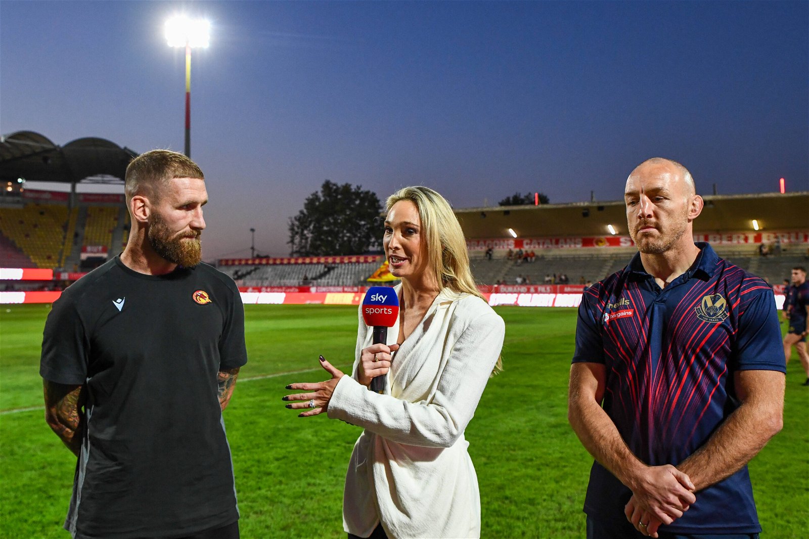 Jenna Brooks of Sky Sports speaking with Catalans Dragons star Sam Tomkins and St Helens legend James Roby