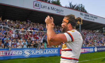 Wakefield Trinity players clap their fans