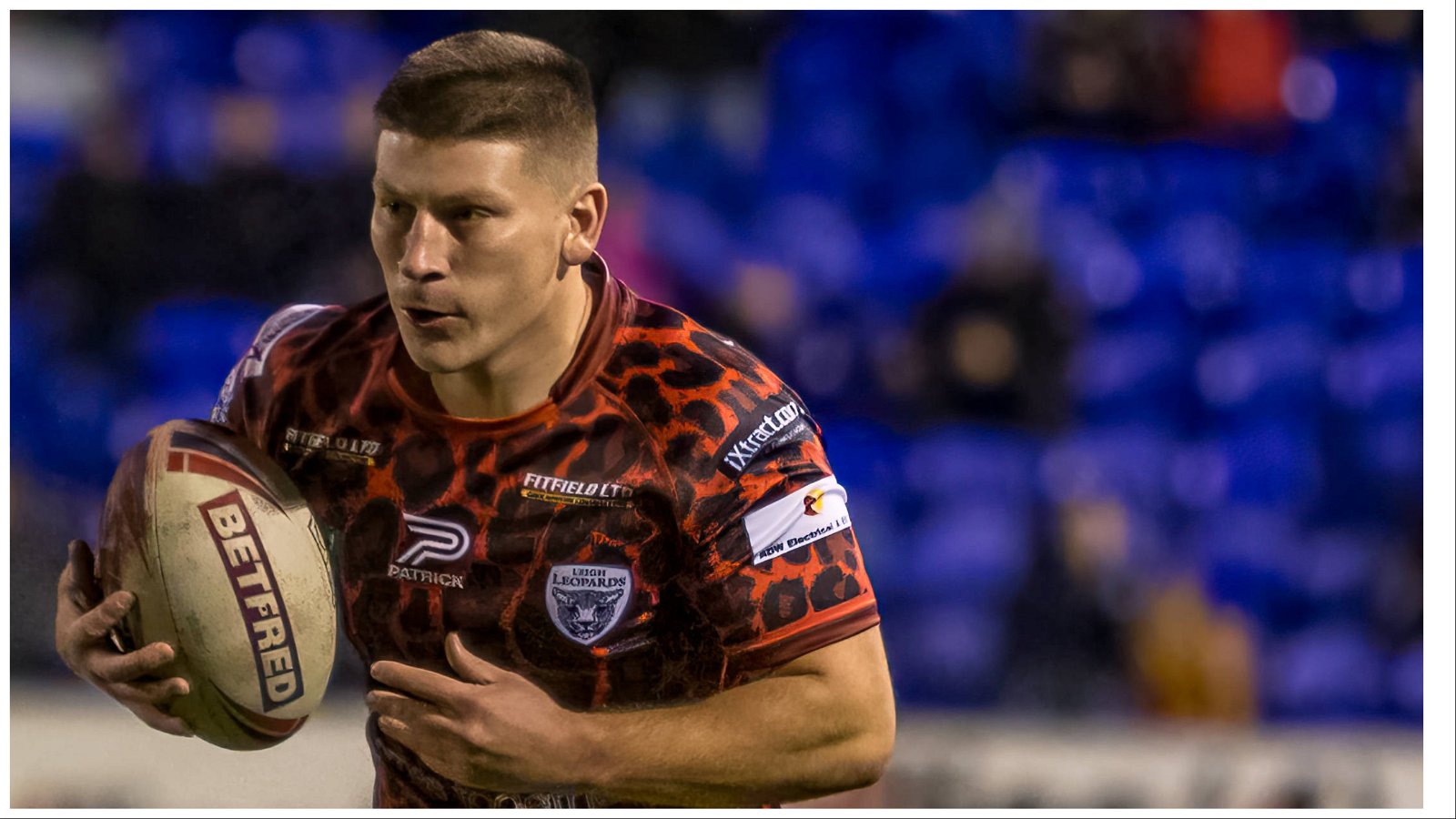 Leigh Leopards back Jacob Jones holds the ball in Super League action