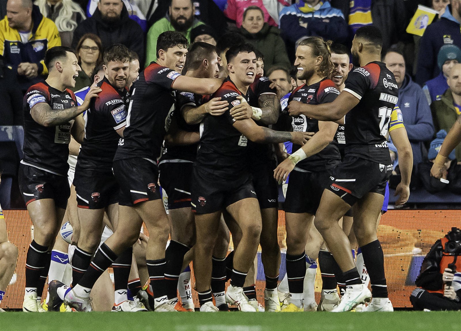 Salford Red Devils celebrate an Oli Partington try in Super League