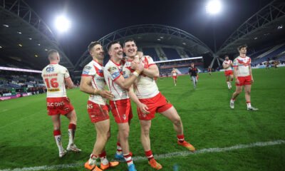 St Helens' Tommy Makinson, Lewis Dodd and Matt Whitley celebrate after the game at Huddersfield