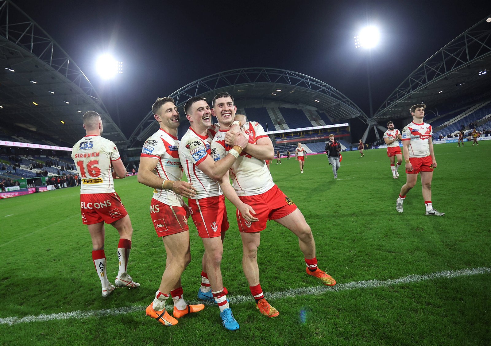 St Helens' Tommy Makinson, Lewis Dodd and Matt Whitley celebrate after the game at Huddersfield