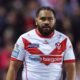 Konrad Hurrell is wearing the St Helens shirt. Of course, it's white with a red V, and there's a thin red line down the sides. The collar and sleeve cuffs are red. The Home Bargains logo on it is huge.