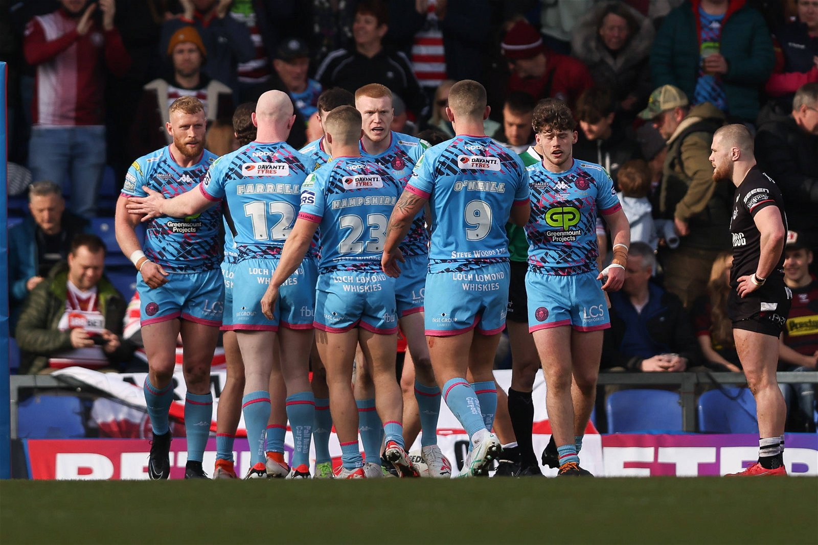 Wigan Warriors players after a Jake Wardle try