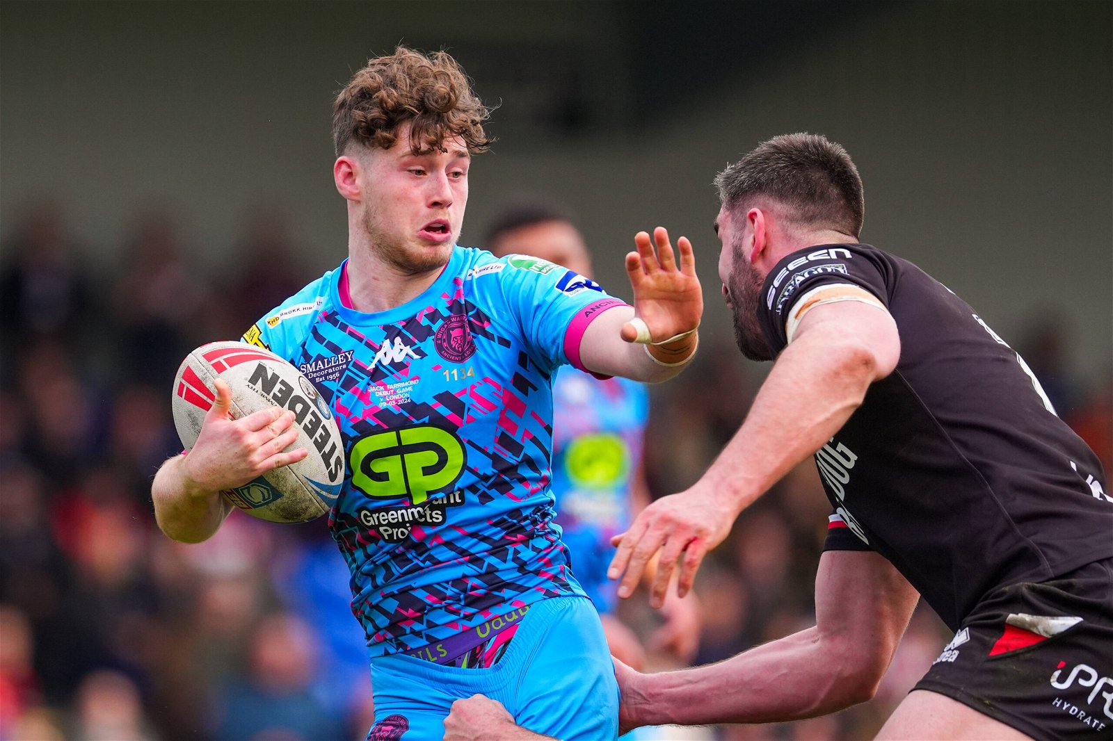 Wigan's Jack Farrimond is tackled against London Broncos.