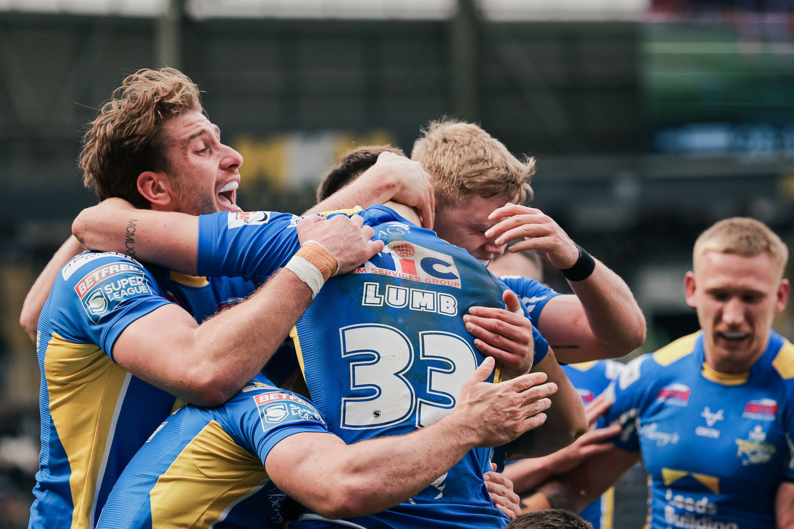 Leeds Rhinos players celebrate a Super League win