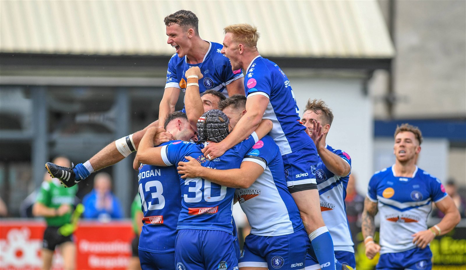 Swinton Lions players celebrate scoring. They have just signed a hooker on loan from Warrington Wolves.