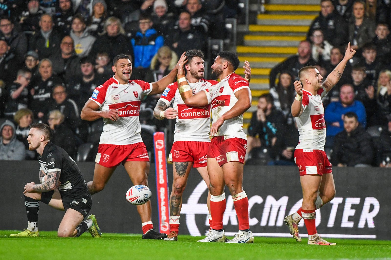 Hull KR Kelepi Tanginoa celebrateing his try with Hull KR s Mikey Lewis and Oliver Gildart