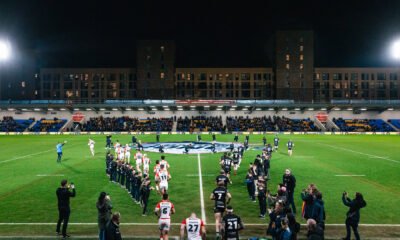 London Broncos and Catalans Dragons players walk out at Plough Lane in Wimbledon for Super League action.