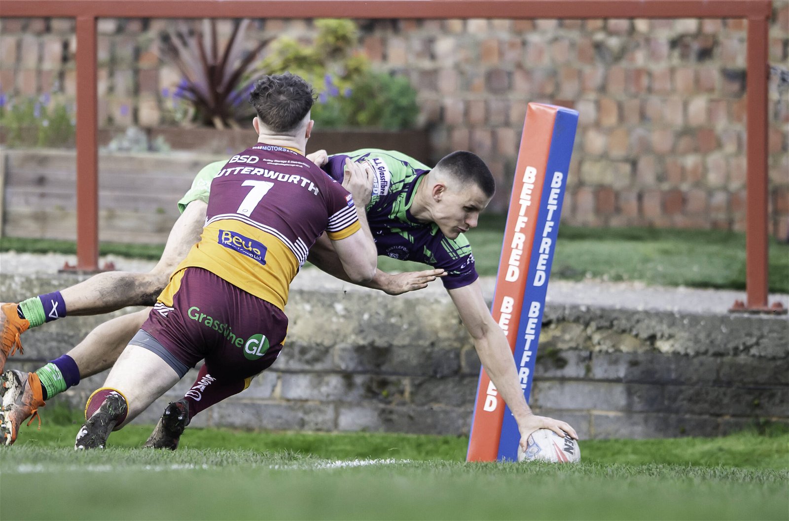 Batley's Robbie Butterworth can't prevent Castleford Tigers winger Innes Senior from scoring a try in the Challenge Cup.