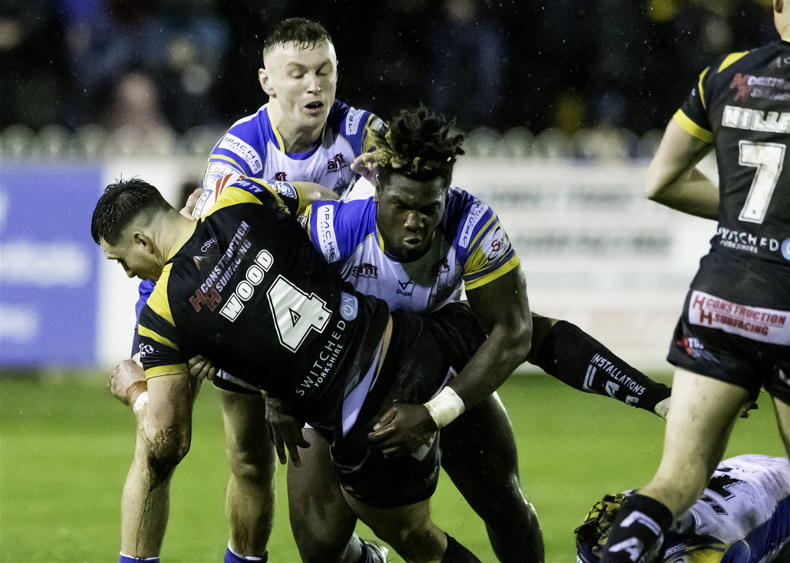Leeds Rhinos' Justin Sangare tackles Castleford Tigers' Sam Wood in the Super League at Wheldon Road.