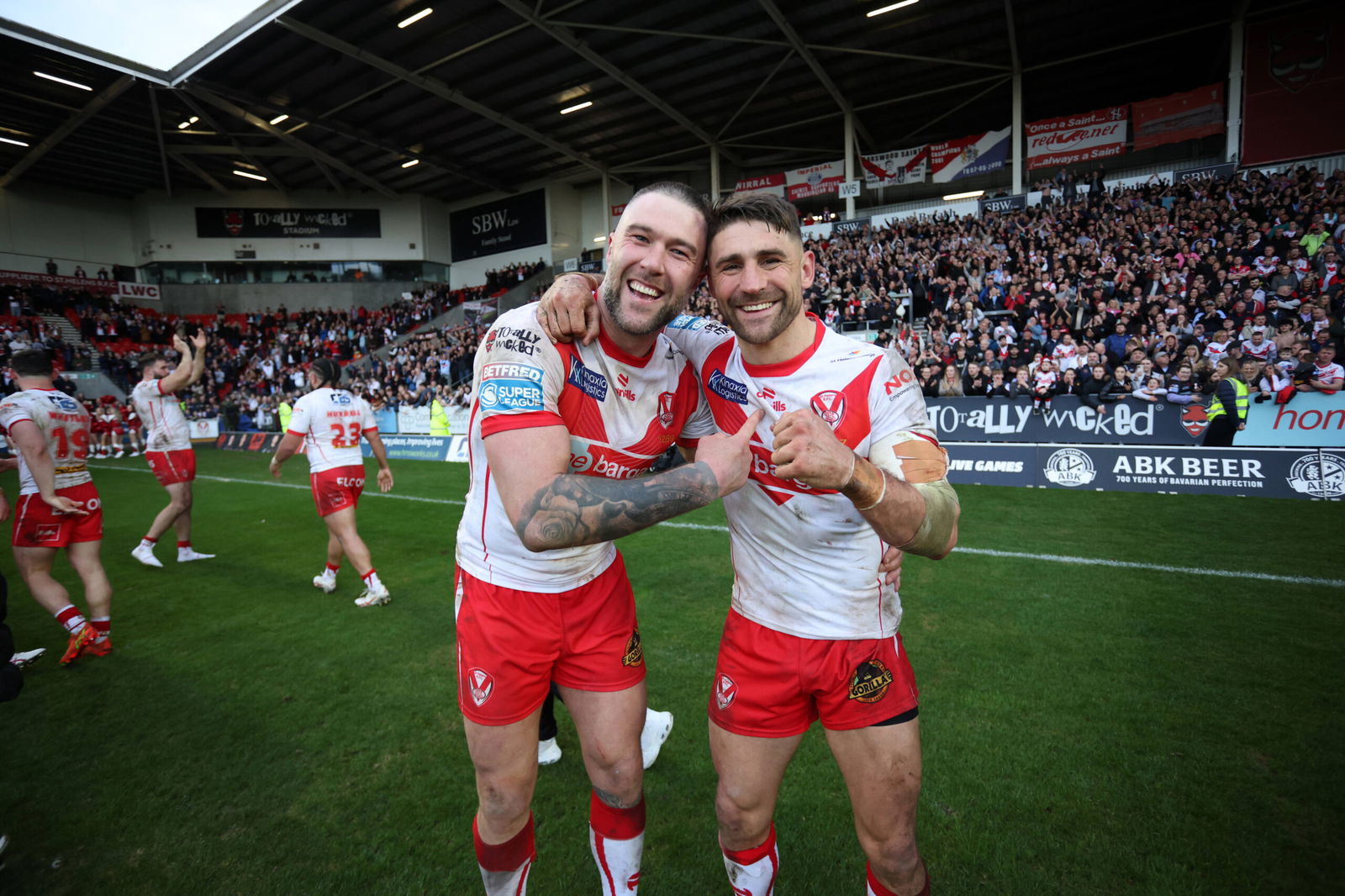 Curtis Sironen and Tommy Makinson celebrate after St Helens vs Wigan Warriors in Super League.England