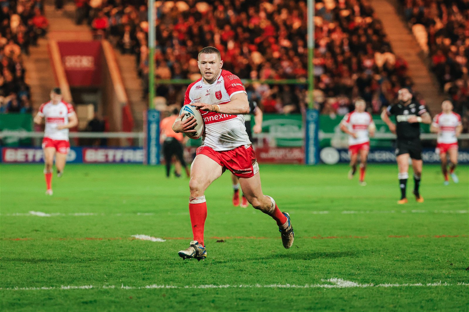James Batchelor of Hull KR runs in for a try.