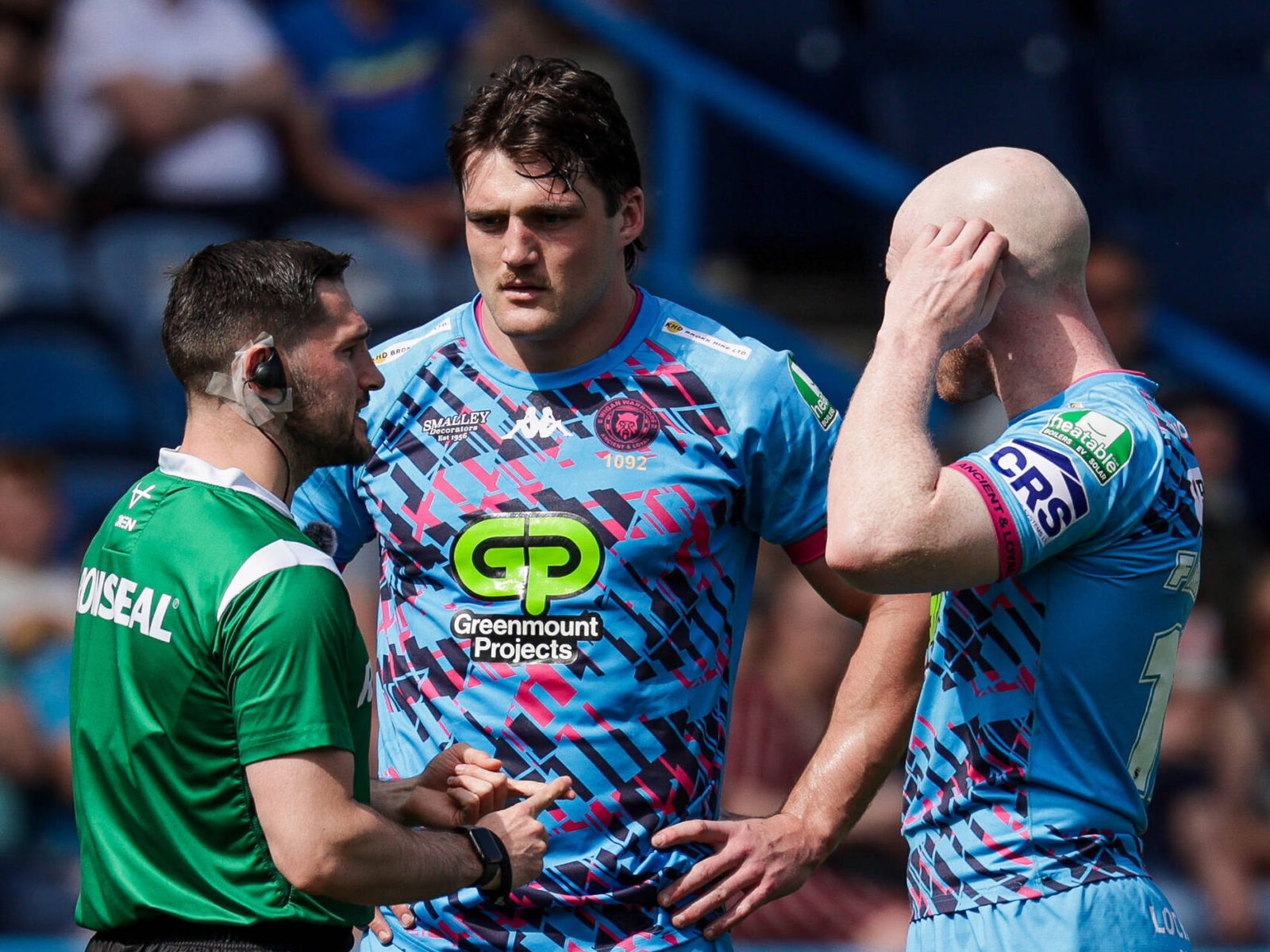 Wigan Warriors' Liam Byrne listens to the referee explaining his decision.