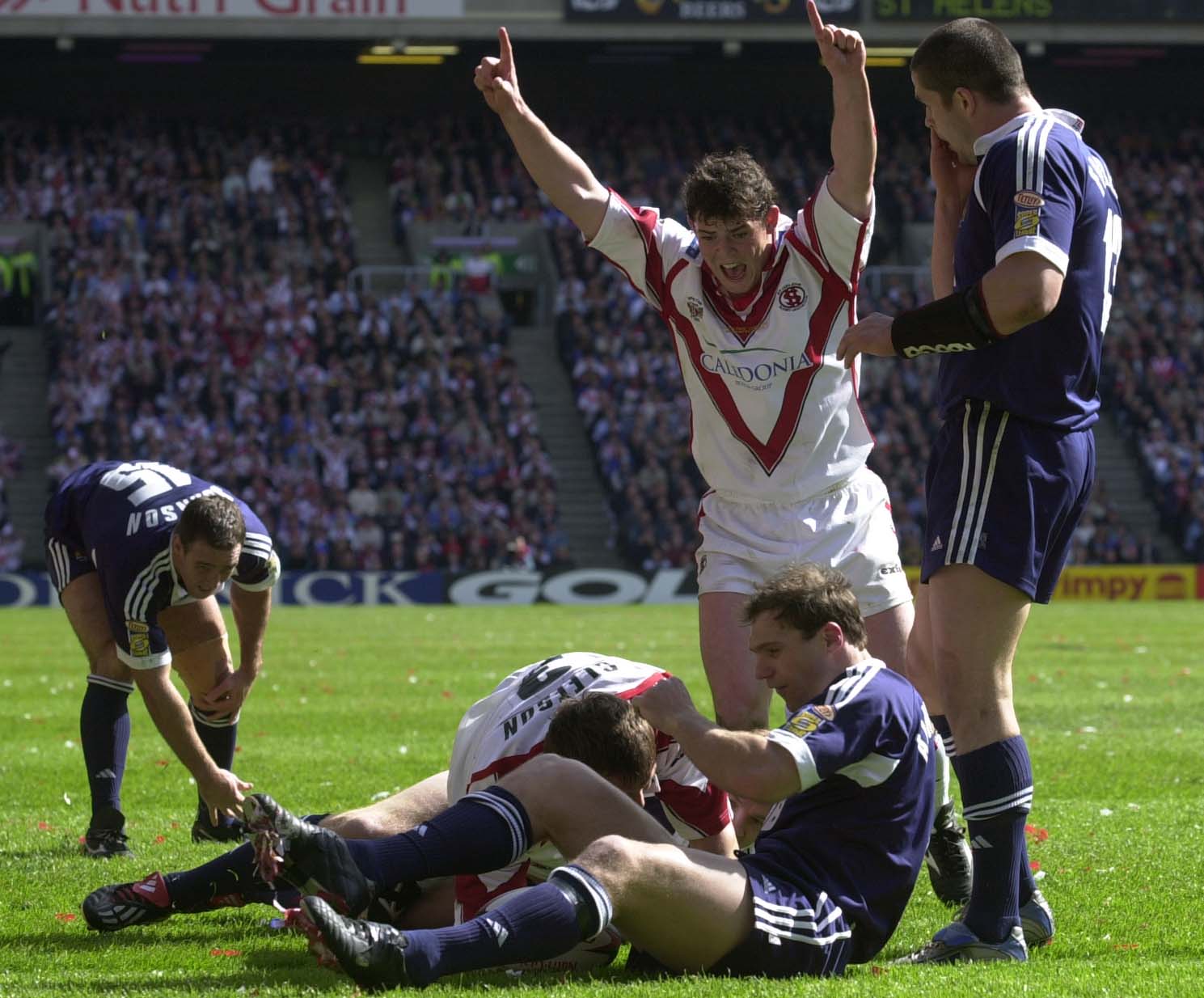 St Helens Paul Wellens celebrates as Martin Gleeson goes over for his second try in the 2002 Challenge Cup final at Murayfield