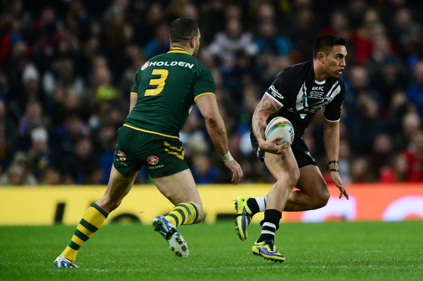     New Zealand's Dean Whare is chased down by Australia's Greg Inglis in the World Cup final.