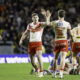 St Helens ' Jack Welsby celebrates with Jon Bennison at Headingley Stadium in Super League.