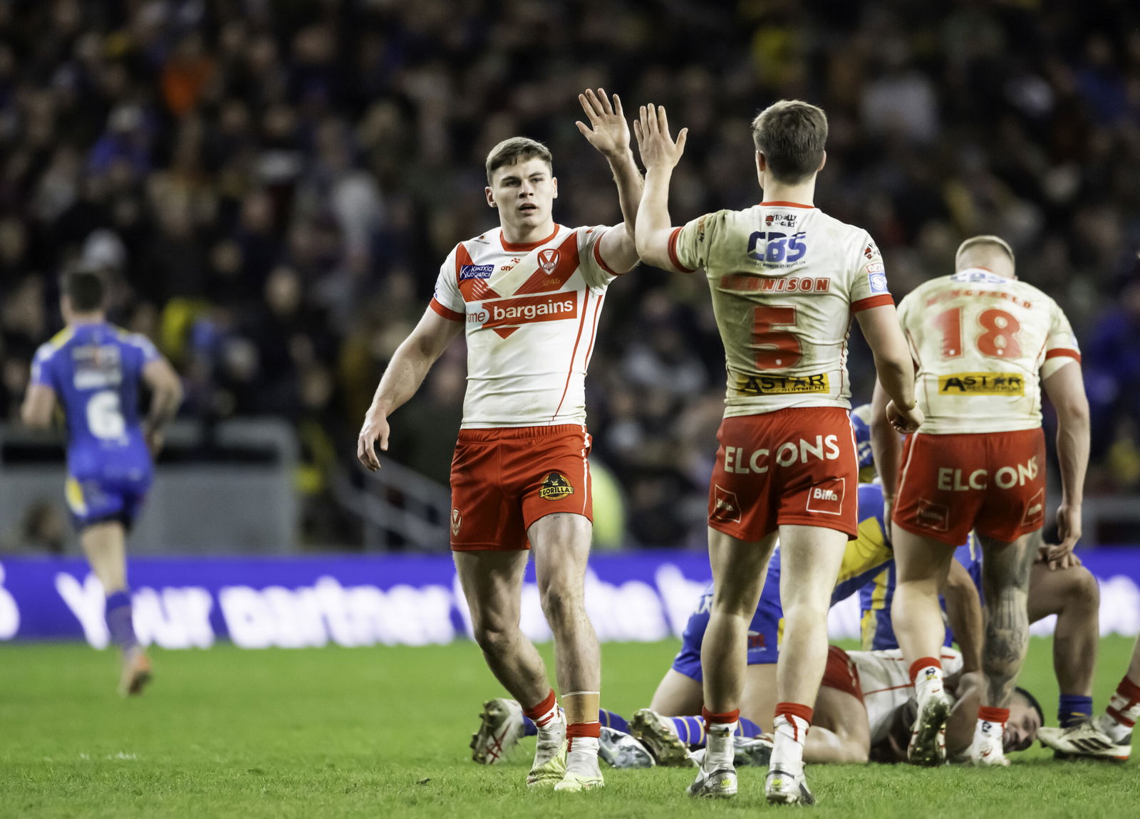 St Helens' Jack Welsby celebrates with Jon Bennison at Headingley Stadium.