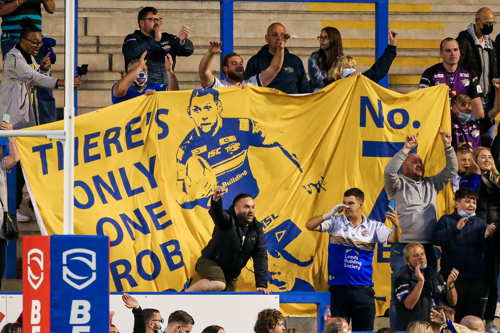 Leeds fans with a Rob Burrow flag.