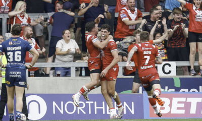 Salford Red Devils Sam Stone celebrates with team mates and fans after scoring a golden point try to win the game