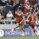 Salford Red Devils Sam Stone celebrates with team mates and fans after scoring a golden point try to win the game