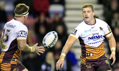 Brisbane s Josh McGuire recives the ball from Jarrod Wallace who has signed for Catalans Dragons