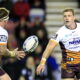 Brisbane s Josh McGuire recives the ball from Jarrod Wallace who has signed for Catalans Dragons
