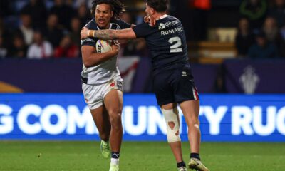 Dom Young of England is tackled by Arthur Romano of France England v France, Rugby League World Cup 2021