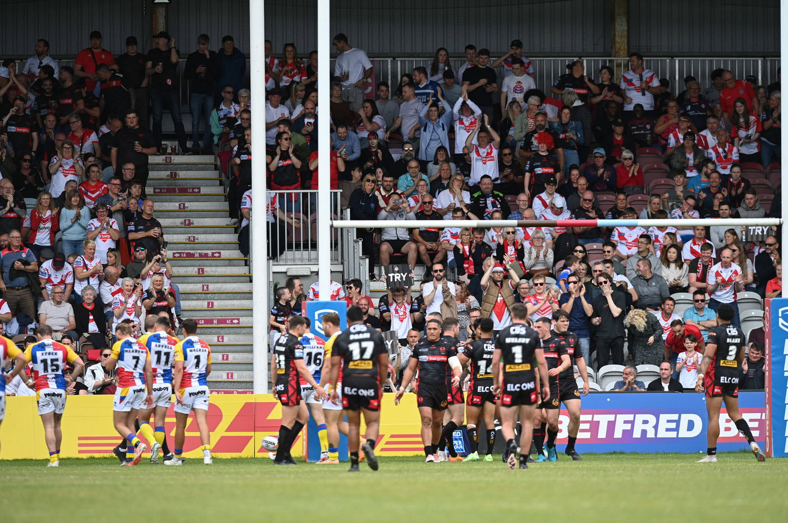 St Helens fans celebrate a try against London Broncos in Super League.