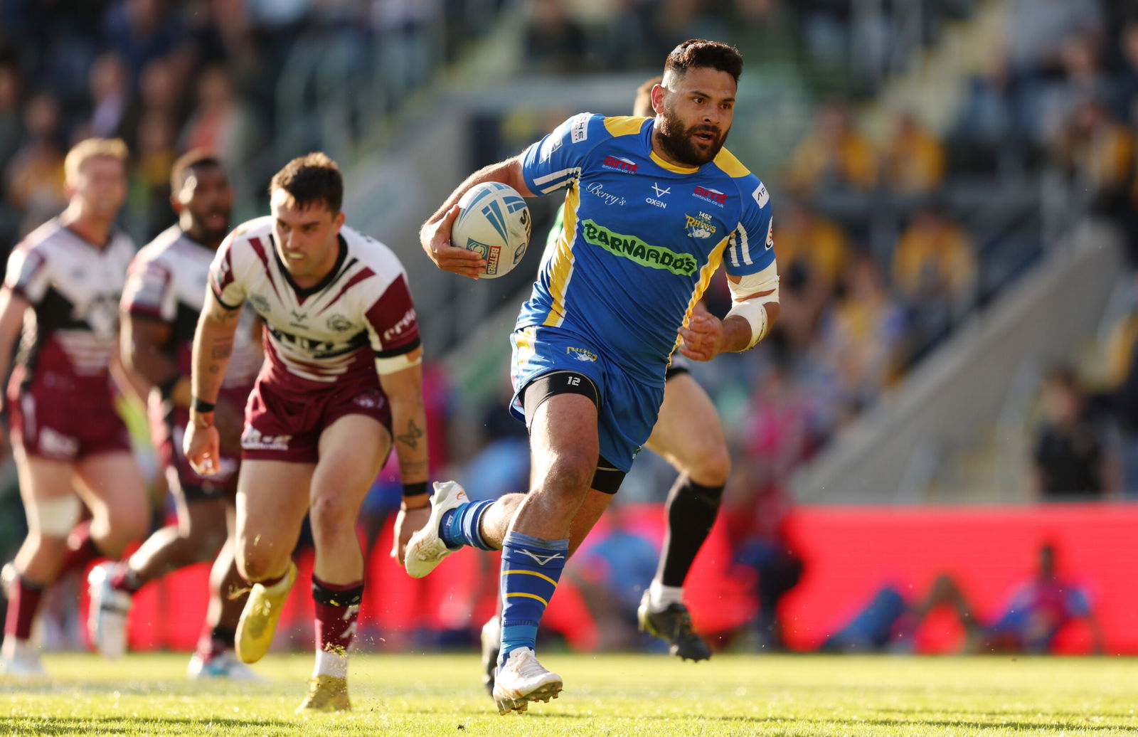 Leeds Rhinos' Rhyse MARtin runs with the ball against Castleford Tiegrs