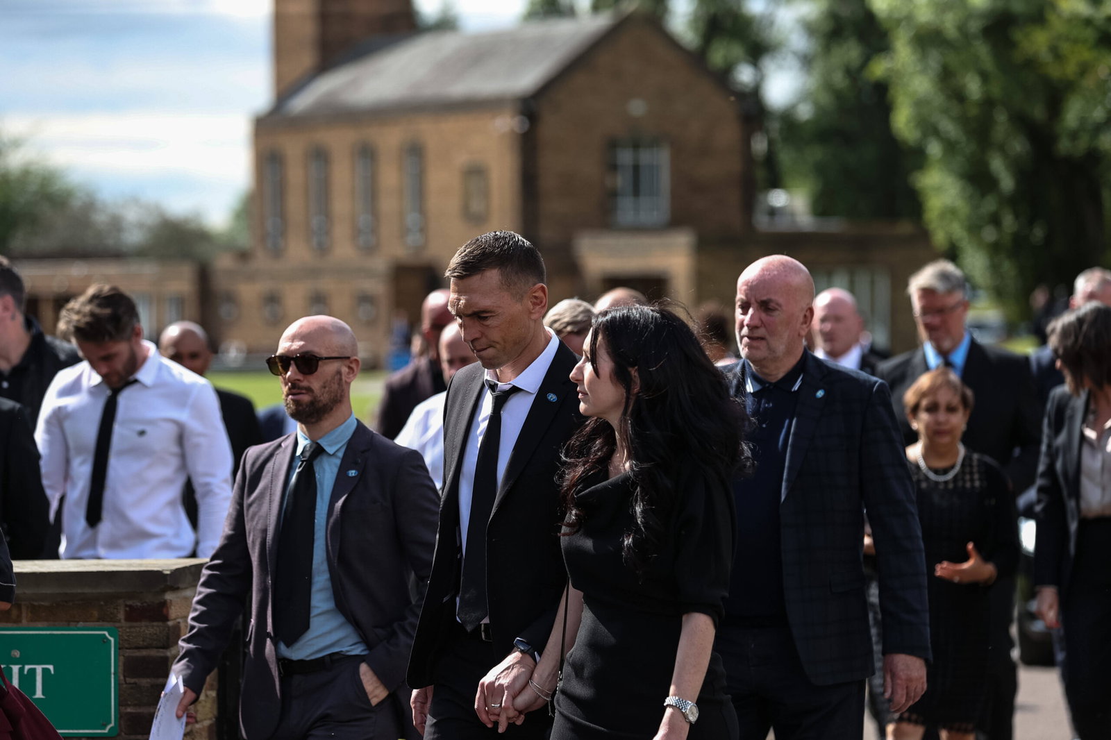 Kevin SInfield walks with his wife