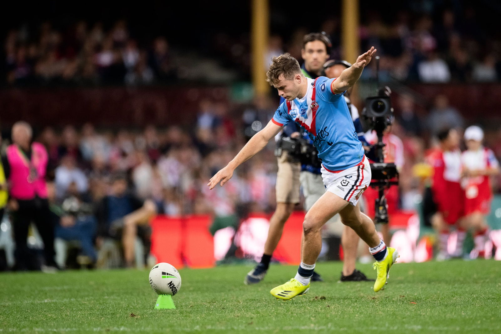 Sam Walker kicks for goal in NRL action.