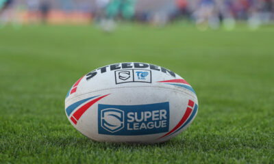 Super League ball on grass