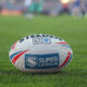 Super League ball on grass
